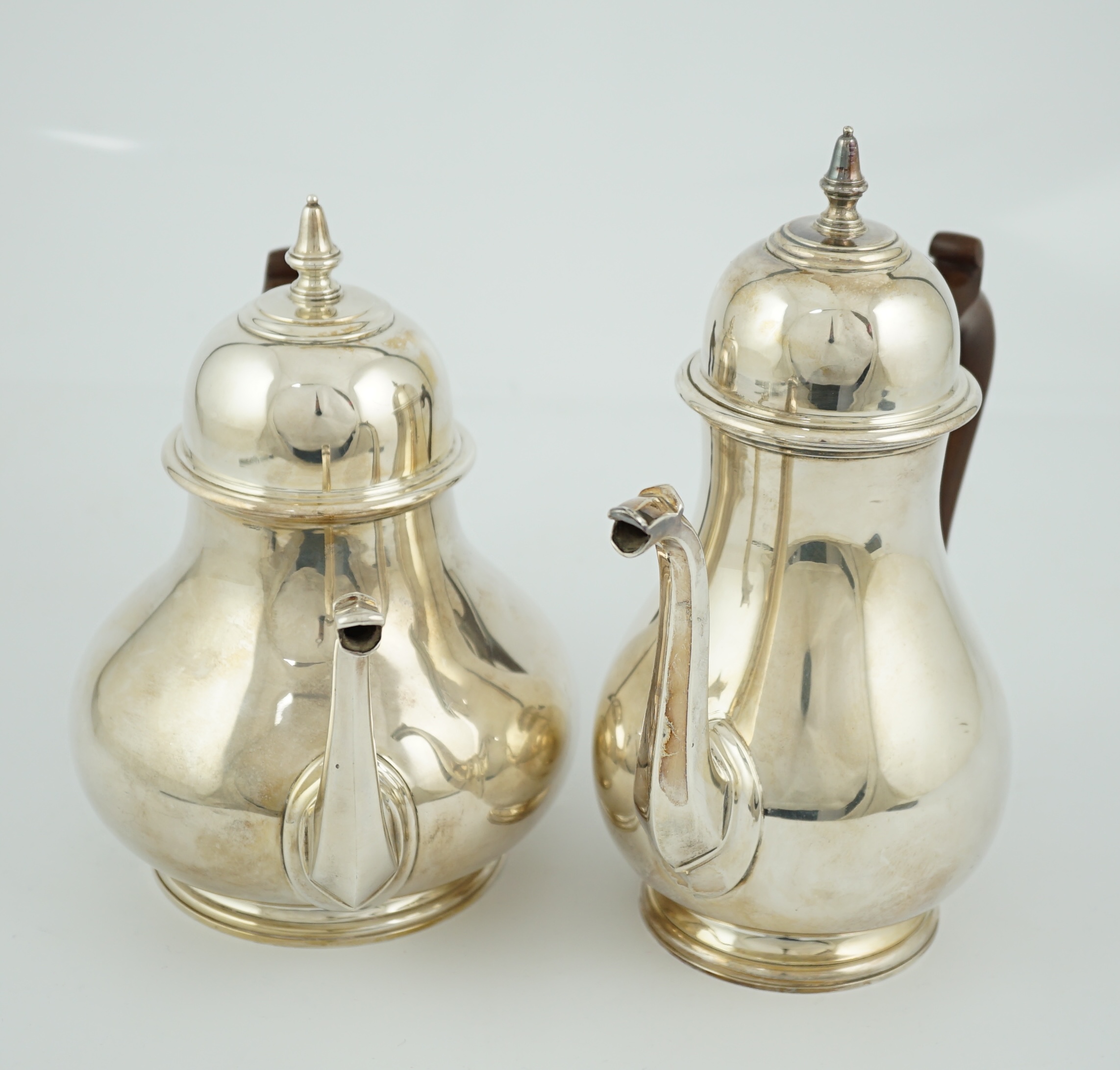 An Elizabeth II 18th century style silver coffee pot and a teapot, by William Comyns & Sons Ltd